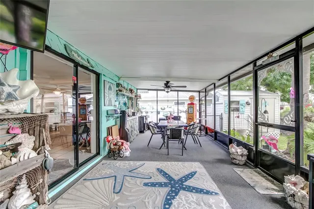 a living room with furniture a fireplace and a table