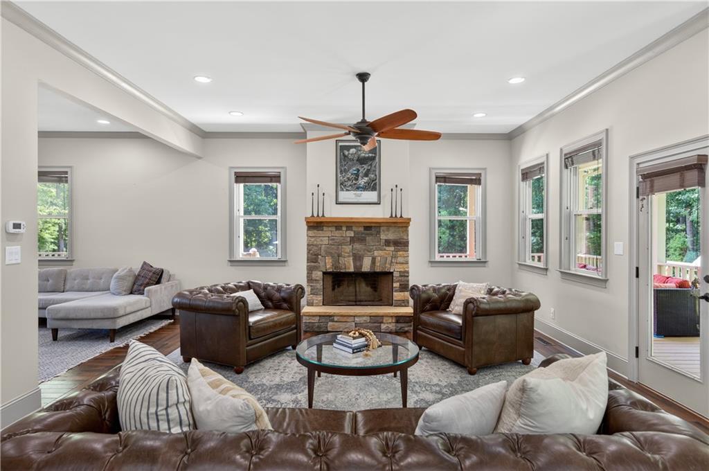 632 Geiger Road Jefferson, GA 30549 - Photo 15 of 55 a living room with furniture a fireplace and a large window