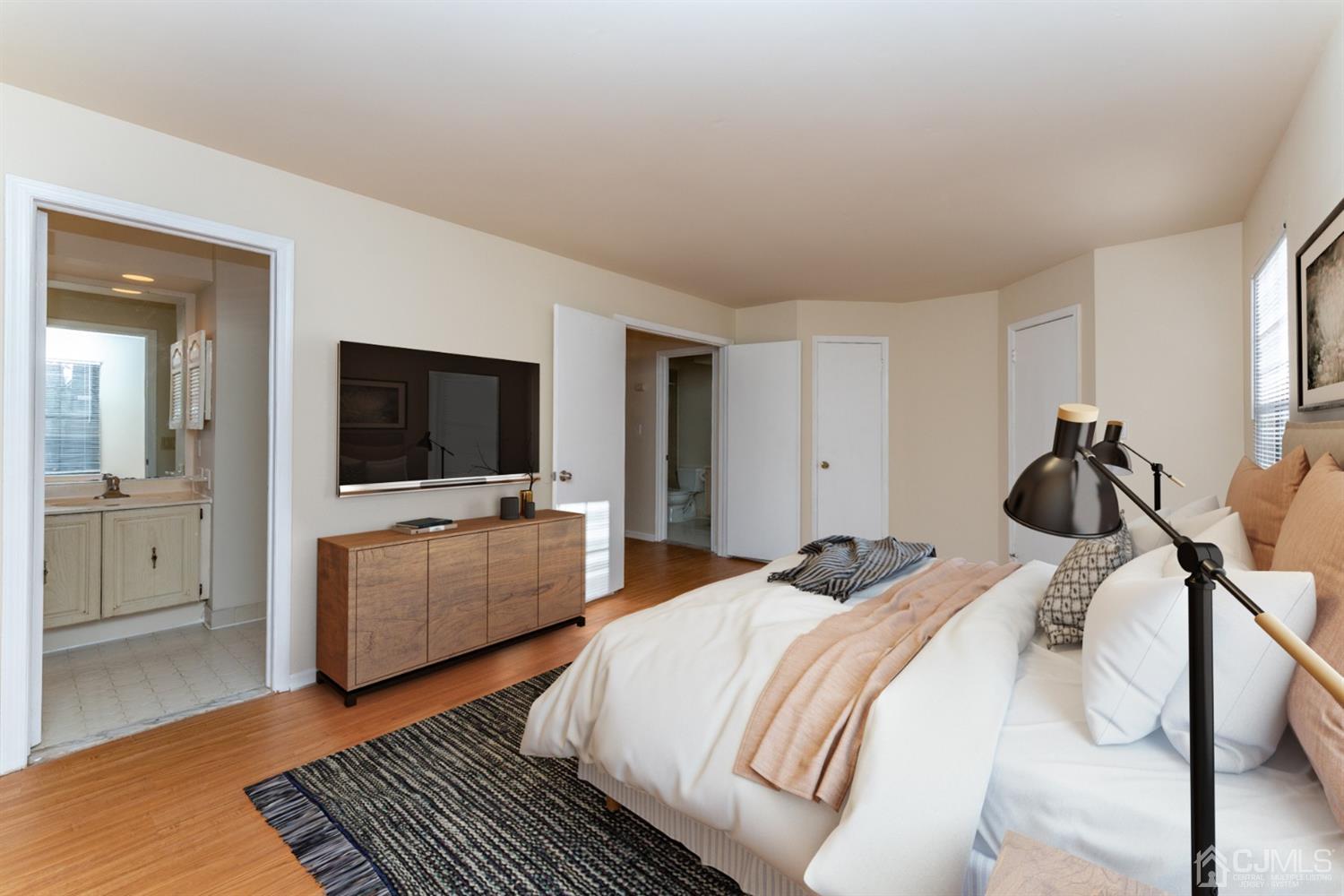 3204 Stonehedge Road Edison, NJ 08820 - Photo 14 of 22 a bedroom with a bed and a flat screen tv