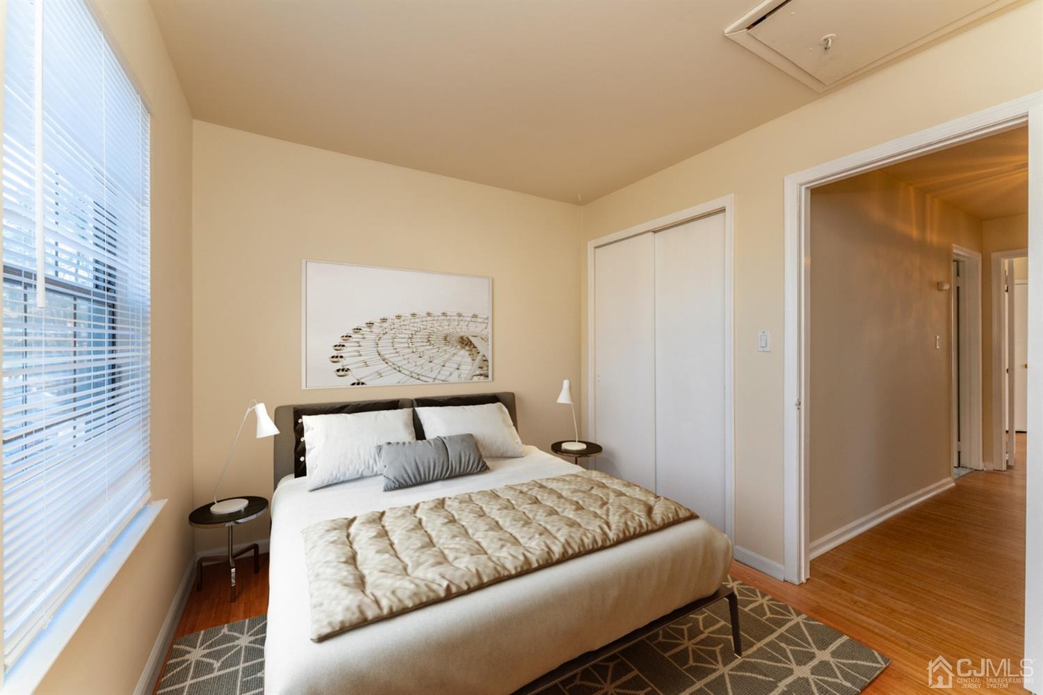 3204 Stonehedge Road Edison, NJ 08820 - Photo 15 of 22 a bedroom with a bed and a painting on the wall