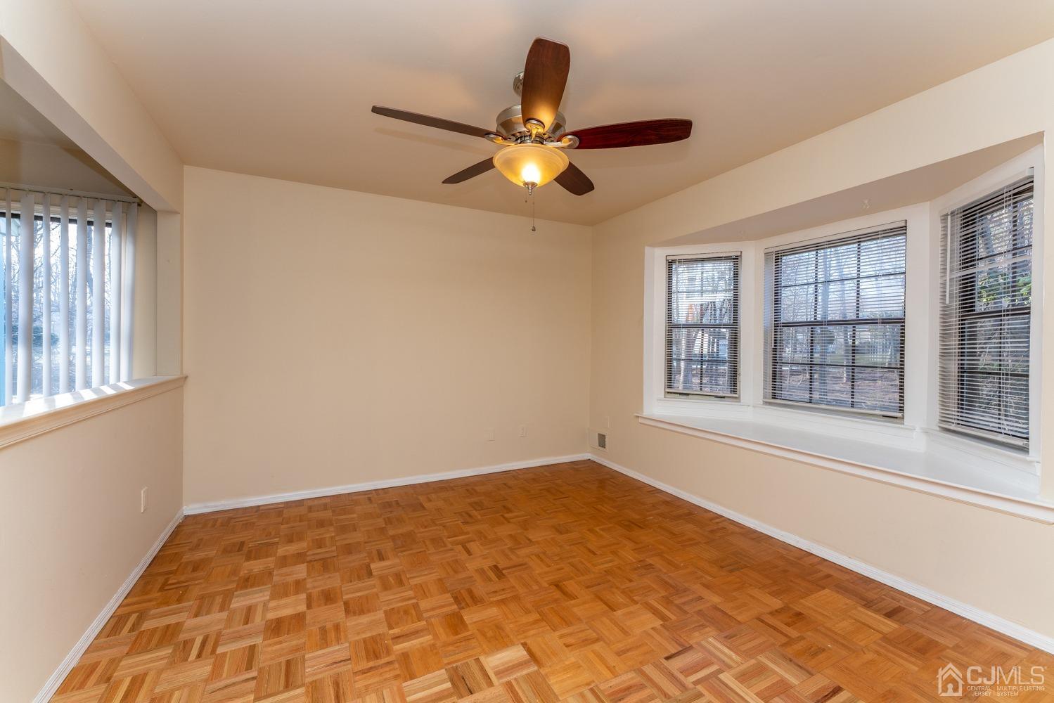 3204 Stonehedge Road Edison, NJ 08820 - Photo 9 of 22 a view of an empty room with a window