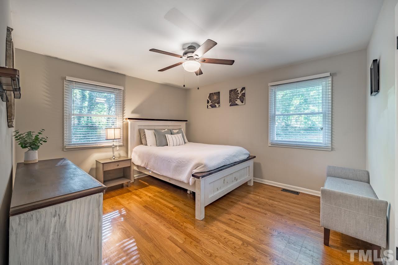1105 Somerset Road Raleigh, NC 27610 - Photo 13 of 19 a bedroom with a bed and window