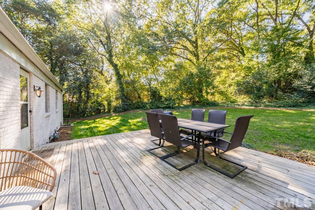 1105 Somerset Road Raleigh, NC 27610 - Photo 16 of 19 a view of a patio with a table and chairs