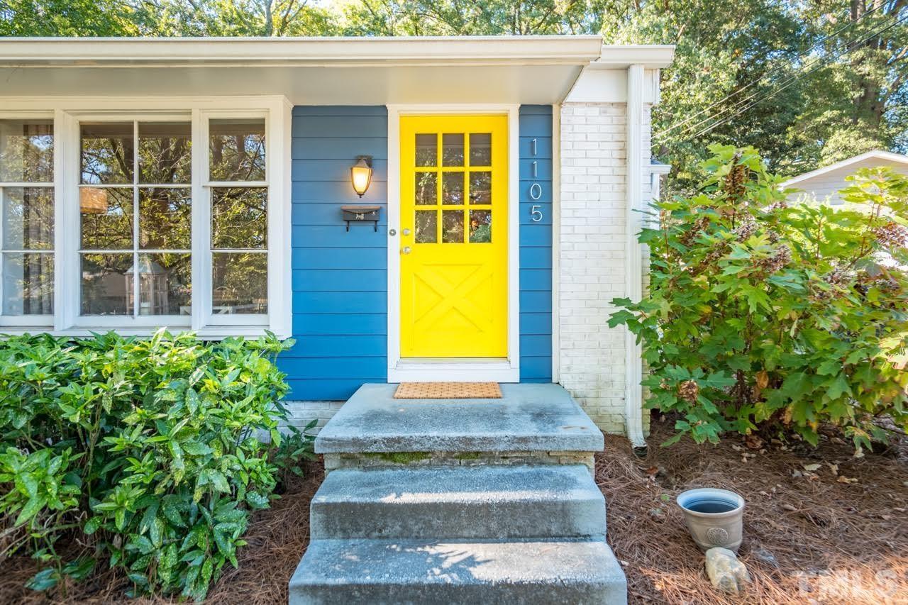 1105 Somerset Road Raleigh, NC 27610 - Photo 3 of 19 a front view of a house with a yard