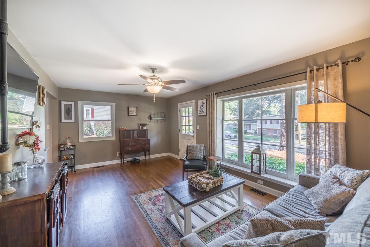 1105 Somerset Road Raleigh, NC 27610 - Photo 5 of 19 a living room with furniture and wooden floor