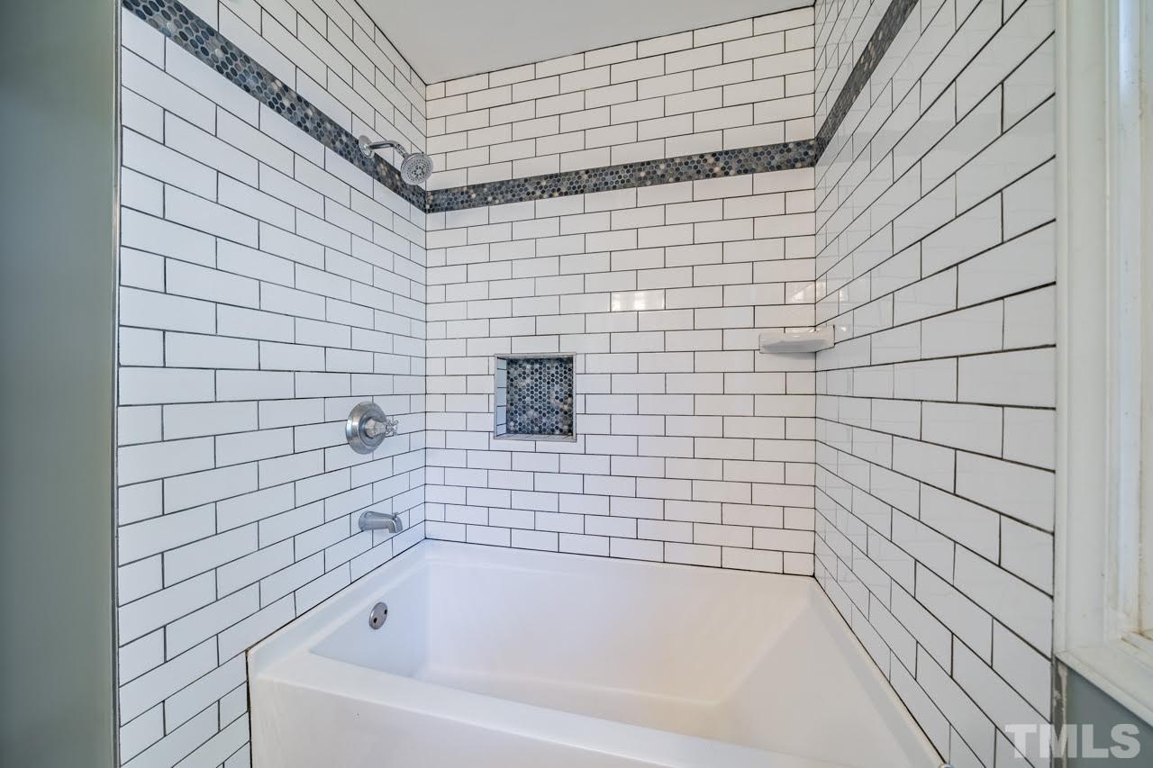 1105 Somerset Road Raleigh, NC 27610 - Photo 10 of 19 a bathroom with a bathtub