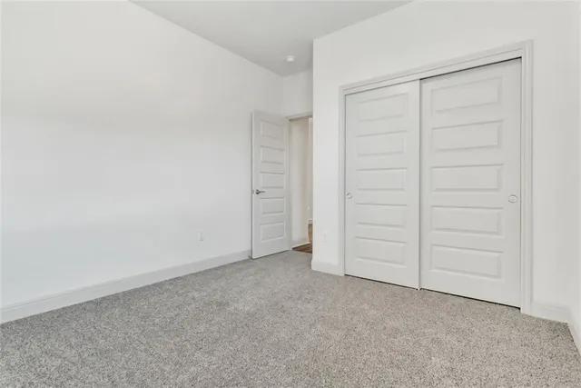 an empty room with closet area