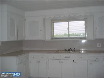 9 Pump Branch Road Berlin, NJ 08009 - Photo 2 of 11 a kitchen with granite countertop white cabinets and a window