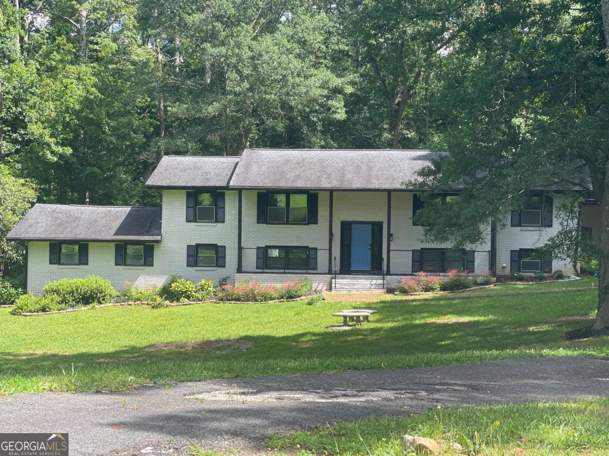 3132 Riders Trail Decatur, GA 30034 - Photo 1 of 1 a front view of a house with garden