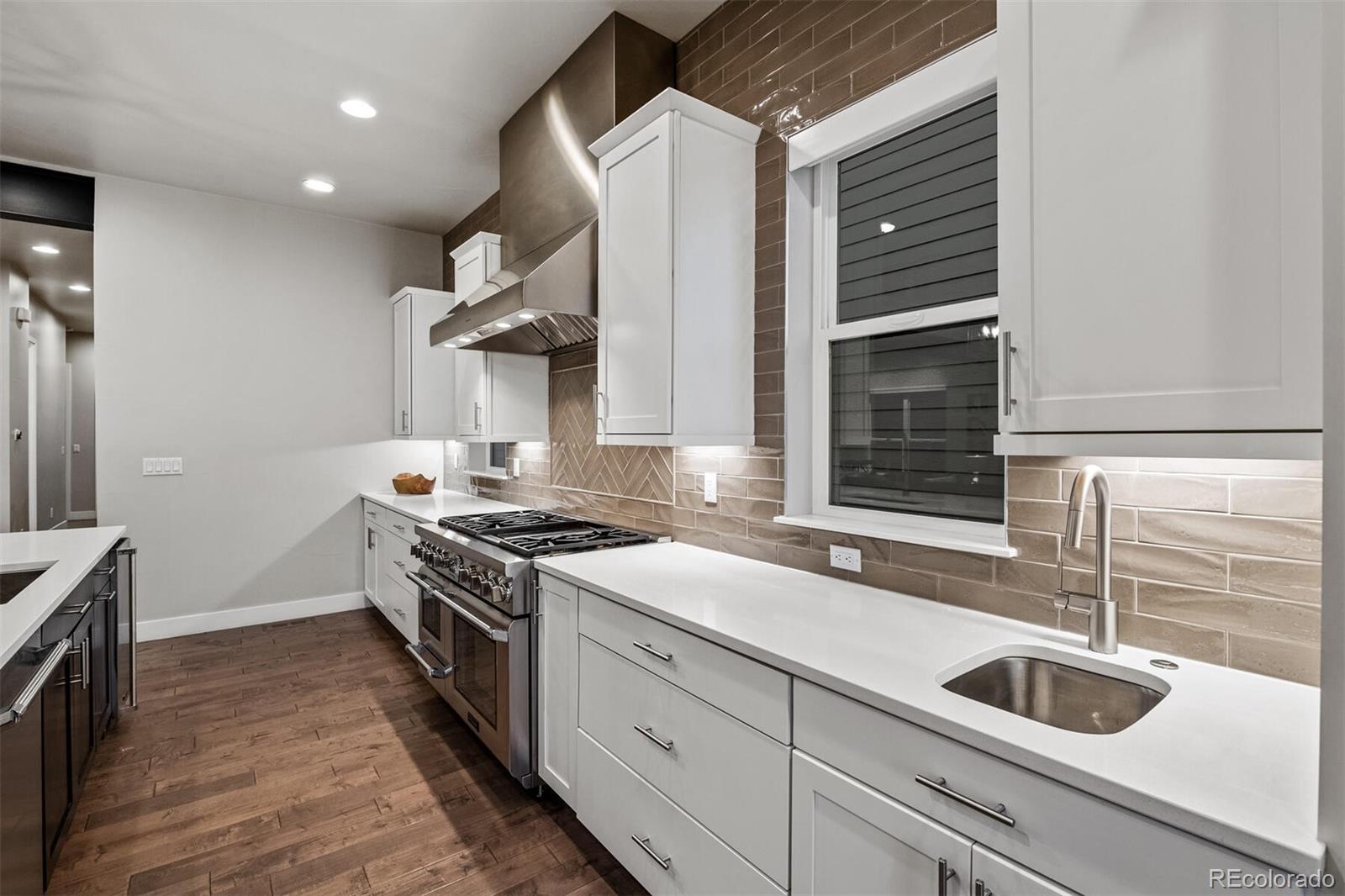 10109 Bellwether Lane Lone Tree, CO 80124 - Photo 11 of 40 a kitchen with a stove and a sink