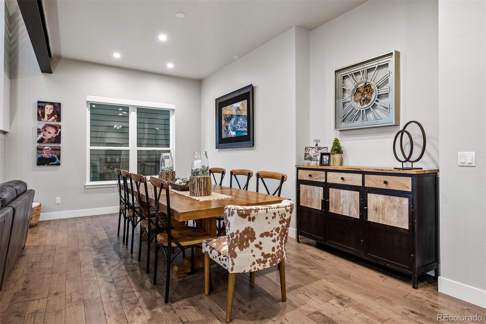 10109 Bellwether Lane Lone Tree, CO 80124 - Photo 14 of 40 a view of a dining room with furniture window and wooden floor