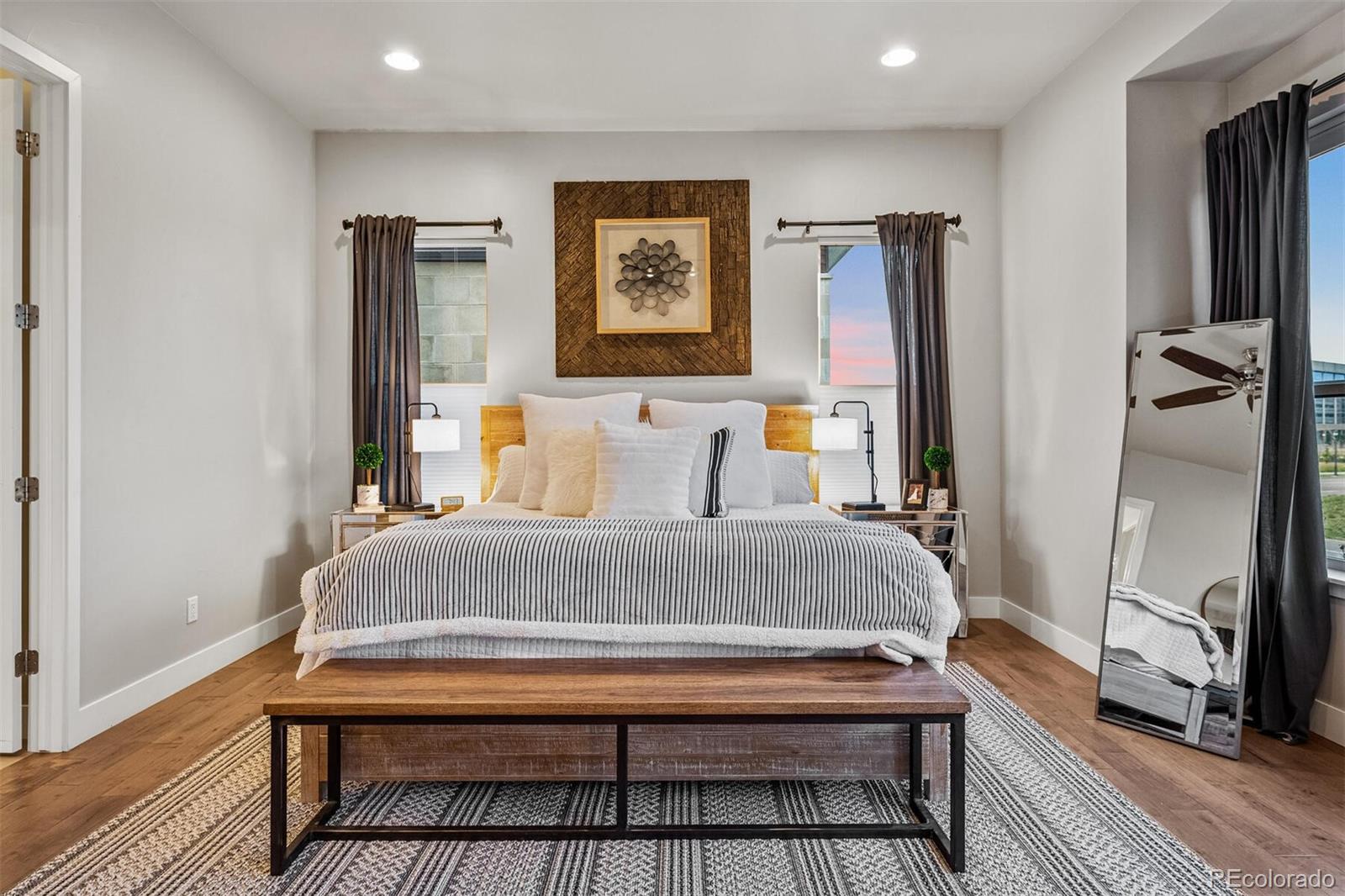 10109 Bellwether Lane Lone Tree, CO 80124 - Photo 16 of 40 a bedroom with a bed and a dresser in it