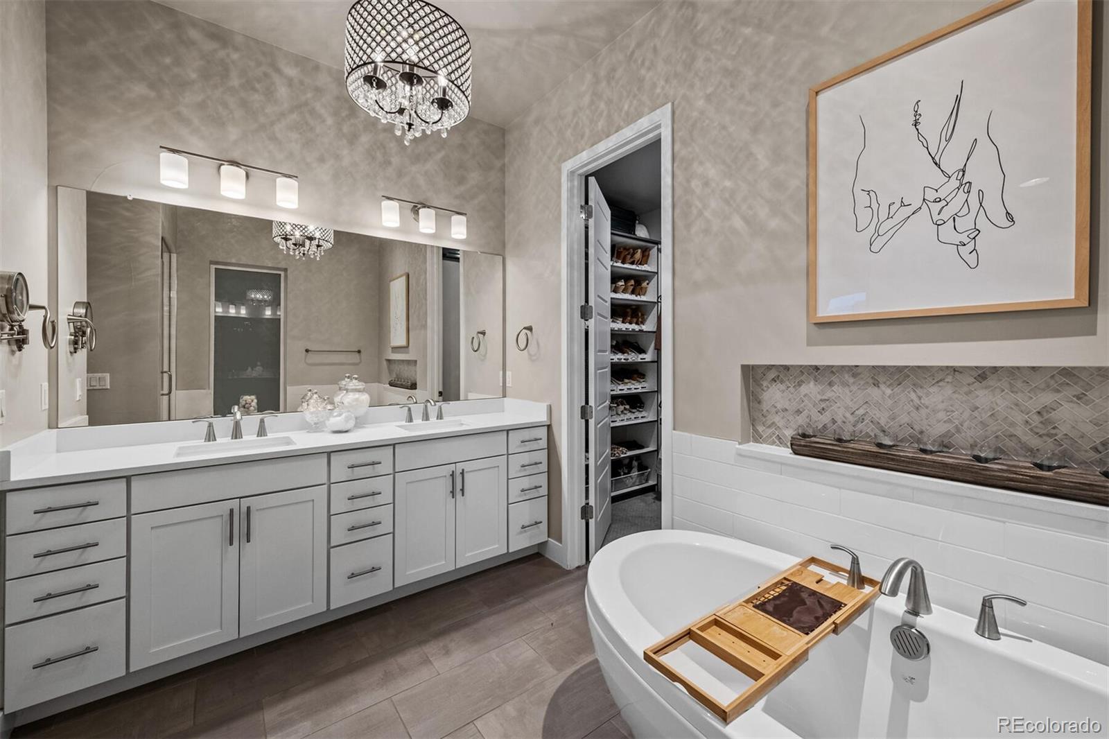 10109 Bellwether Lane Lone Tree, CO 80124 - Photo 20 of 40 a bathroom with a tub sink and mirror