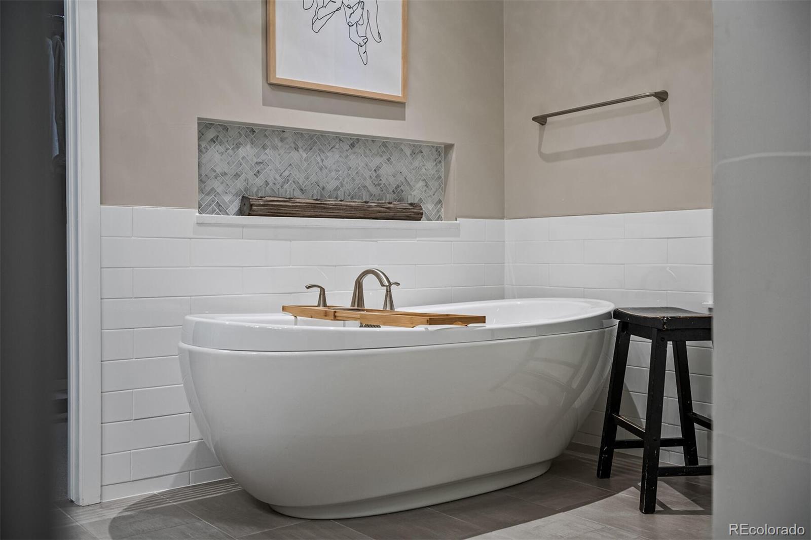 10109 Bellwether Lane Lone Tree, CO 80124 - Photo 21 of 40 a white bath tub sitting in a bathroom