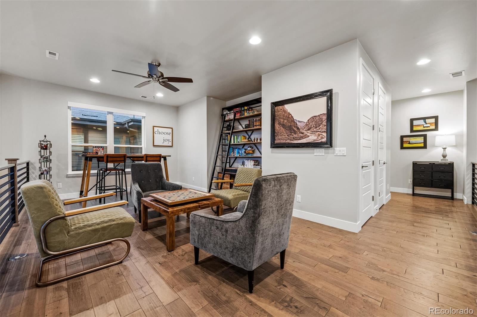 10109 Bellwether Lane Lone Tree, CO 80124 - Photo 24 of 40 a work room with furniture and wooden floor