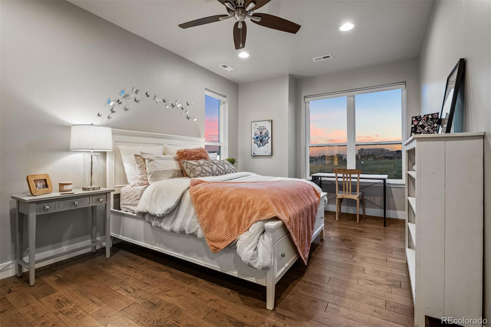 10109 Bellwether Lane Lone Tree, CO 80124 - Photo 26 of 40 a bed room with a bed and a ceiling fan