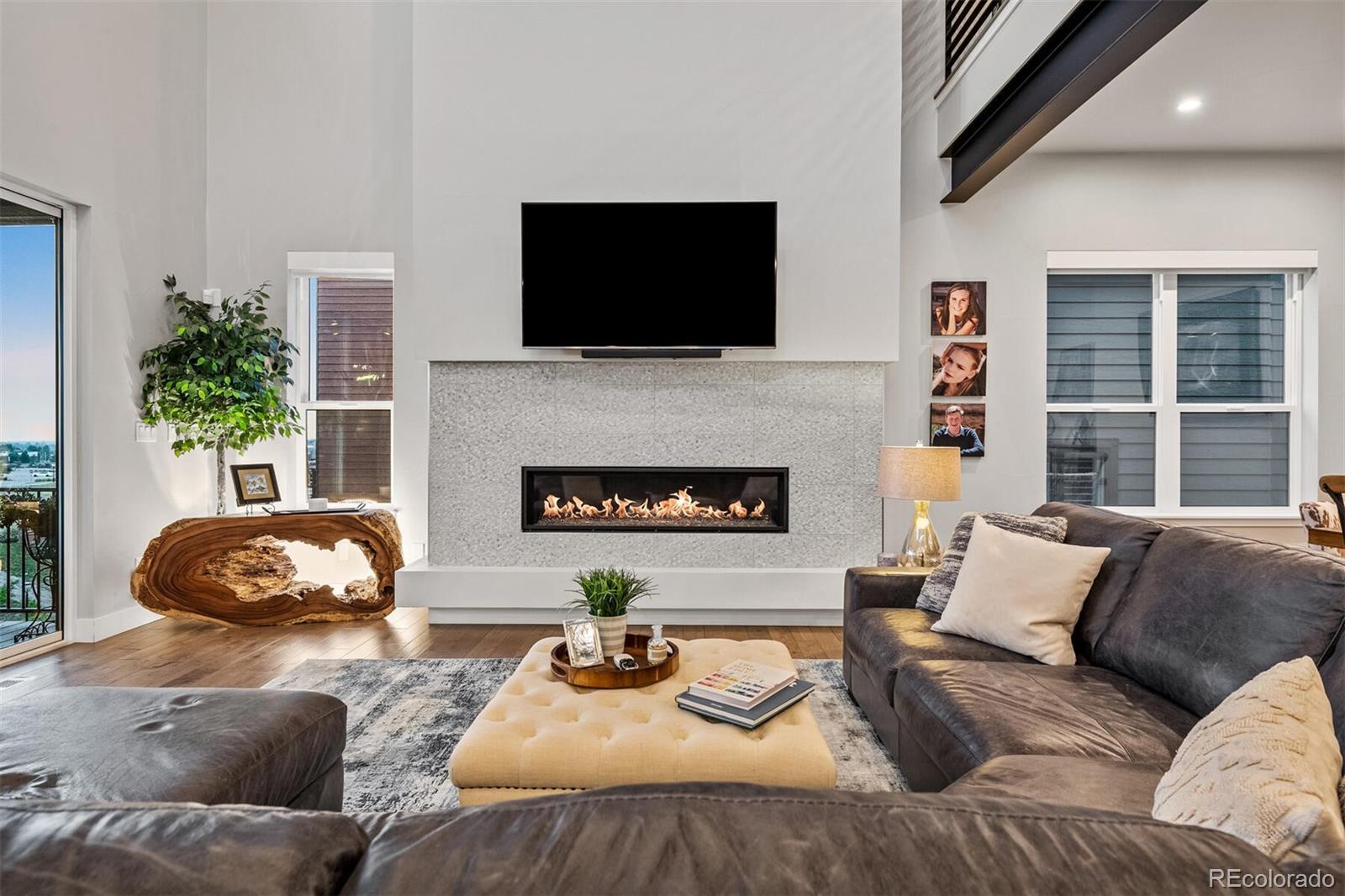 10109 Bellwether Lane Lone Tree, CO 80124 - Photo 4 of 40 a living room with furniture and a fireplace