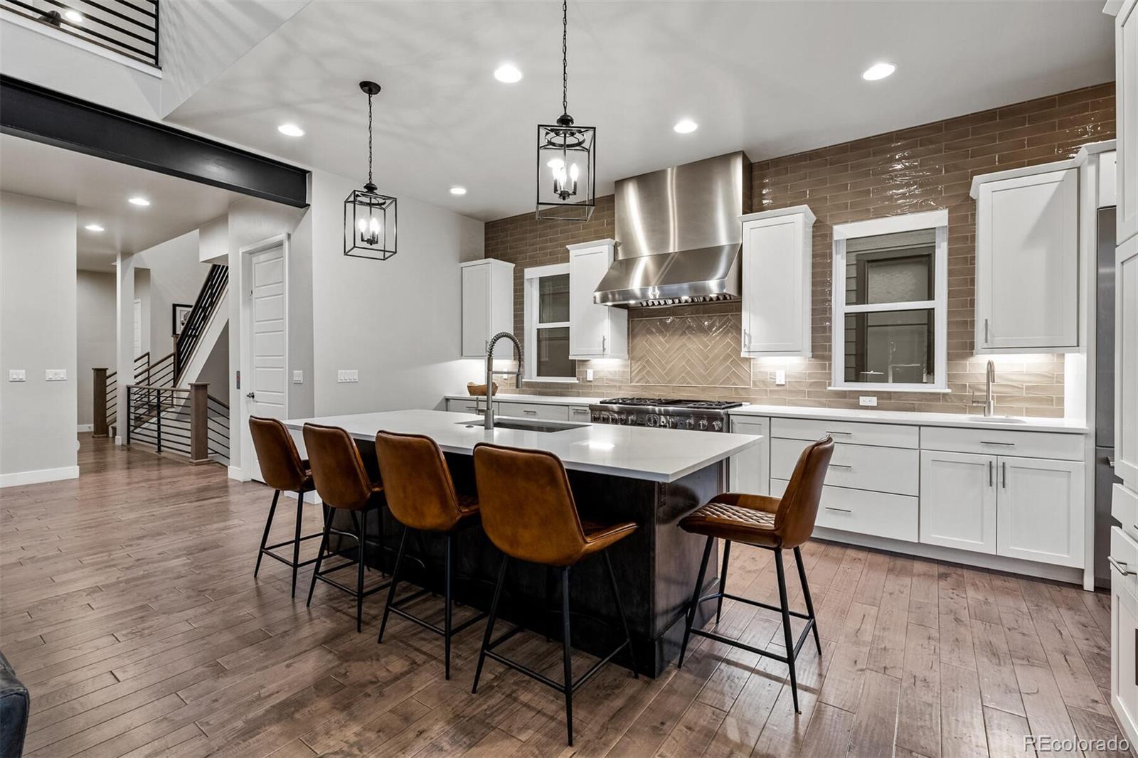 10109 Bellwether Lane Lone Tree, CO 80124 - Photo 10 of 40 a large kitchen with a table and chairs