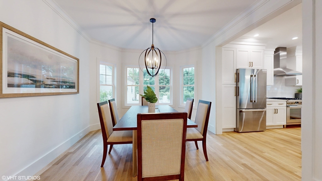 49 Ledge Hill Road Boston, MA 02132 - Photo 14 of 34 a dining room with furniture a chandelier and wooden floor