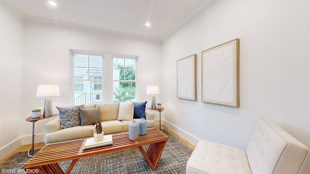 49 Ledge Hill Road Boston, MA 02132 - Photo 18 of 34 a living room with furniture and a large window