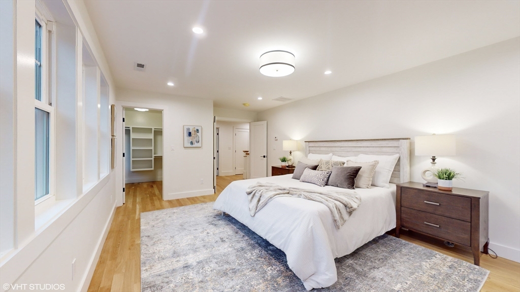 49 Ledge Hill Road Boston, MA 02132 - Photo 20 of 34 a large bedroom with a bed and a couch