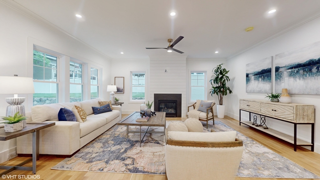 49 Ledge Hill Road Boston, MA 02132 - Photo 2 of 34 a living room with furniture a fireplace and a potted plant