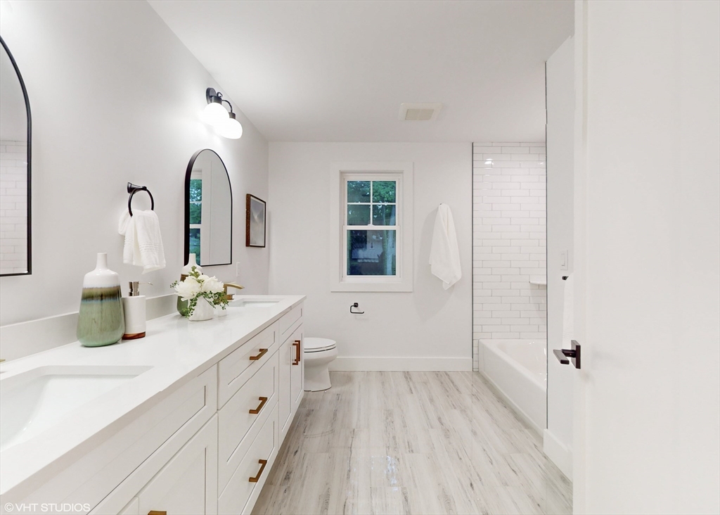 49 Ledge Hill Road Boston, MA 02132 - Photo 26 of 34 a spacious bathroom with a double vanity sink and mirror