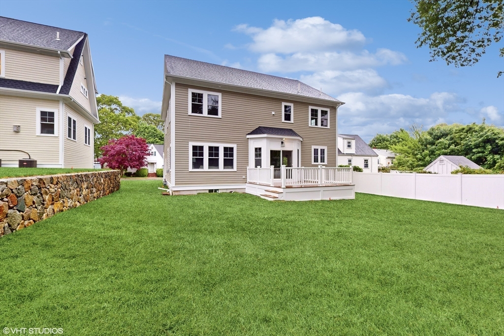 49 Ledge Hill Road Boston, MA 02132 - Photo 30 of 34 a front view of a house with a garden and yard