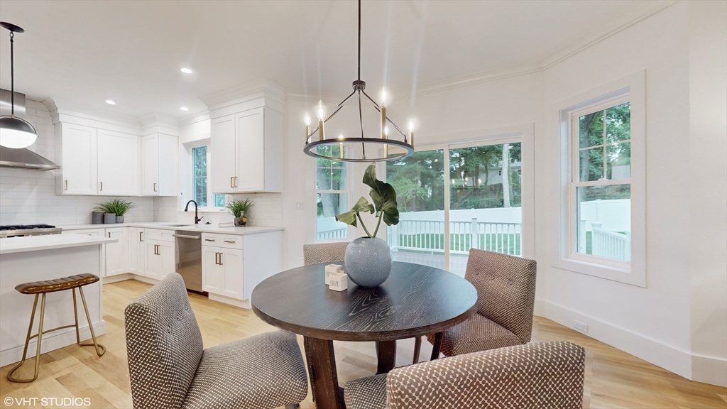 49 Ledge Hill Road Boston, MA 02132 - Photo 7 of 34 a kitchen with a table chairs stove and kitchen view