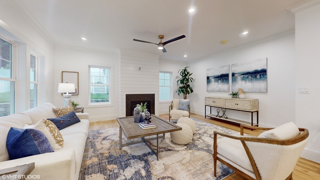 49 Ledge Hill Road Boston, MA 02132 - Photo 8 of 34 a living room with furniture and a fireplace