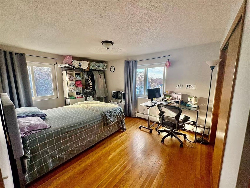 80 Main Street, Unit 26 Malden, MA 02148 - Photo 5 of 8 a bed room with a bed and furniture