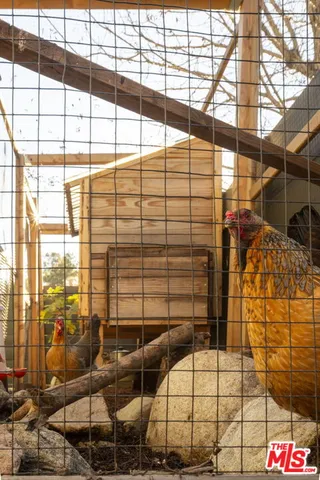 a view of a balcony with mountain view and wooden floor