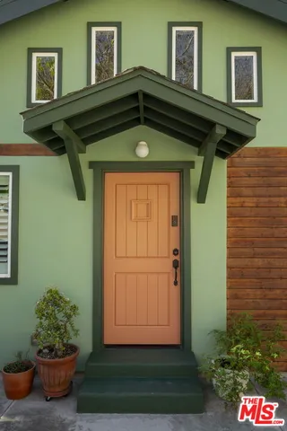 a kitchen with a refrigerator and a sink
