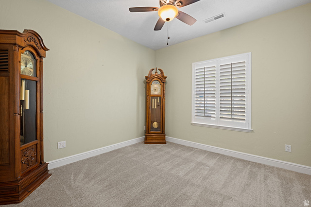 20 Valley Road Leeds, UT 84746 - Photo 13 of 57 Carpeted room featuring a ceiling fan with integrated lighting, a window with white plantation shutters, and light-toned wall paint