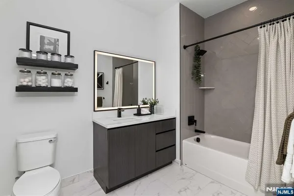 a view of a patio with a table and chairs