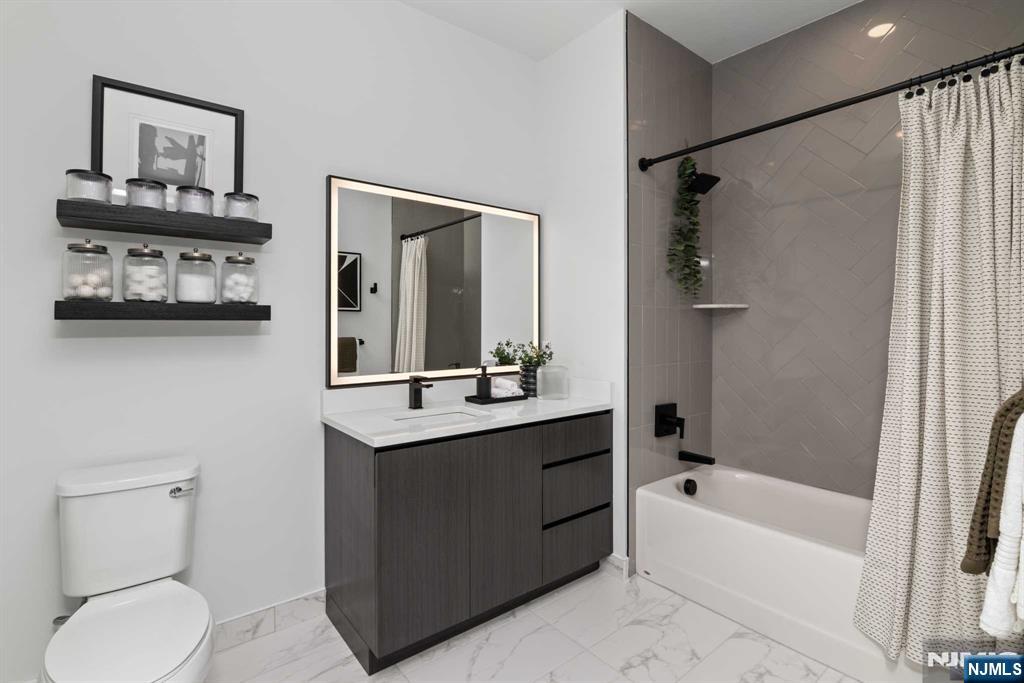 18 Park Avenue, Unit 1319 Old Tappan, NJ 07675 - Photo 29 of 33 a bathroom with a sink toilet and shower