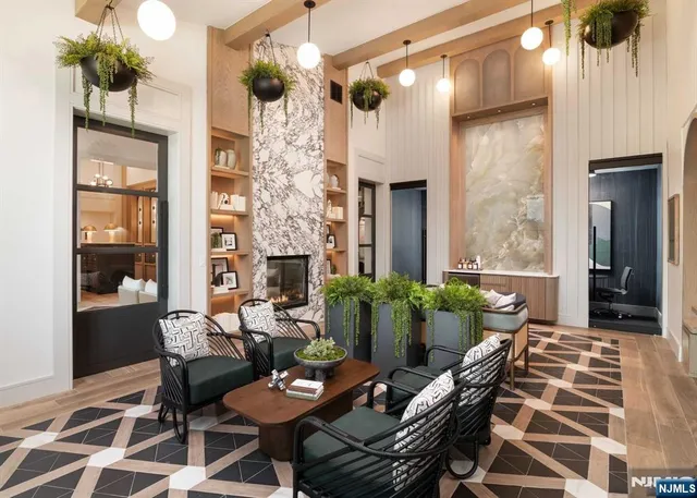 a living room with furniture and potted plants