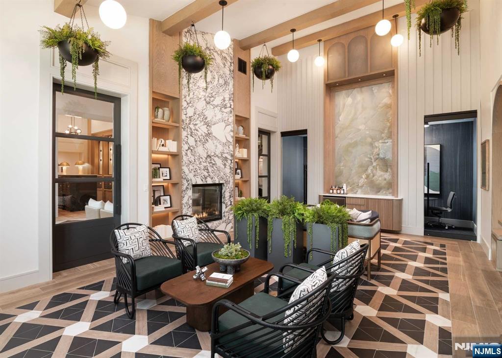 18 Park Avenue, Unit 1319 Old Tappan, NJ 07675 - Photo 4 of 33 a living room with furniture and a fireplace