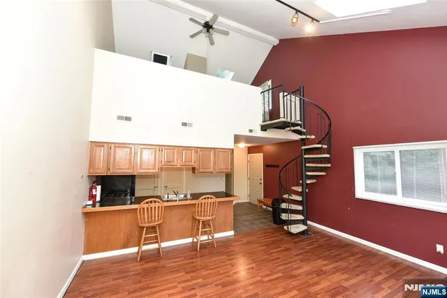 a view of kitchen and wooden floor