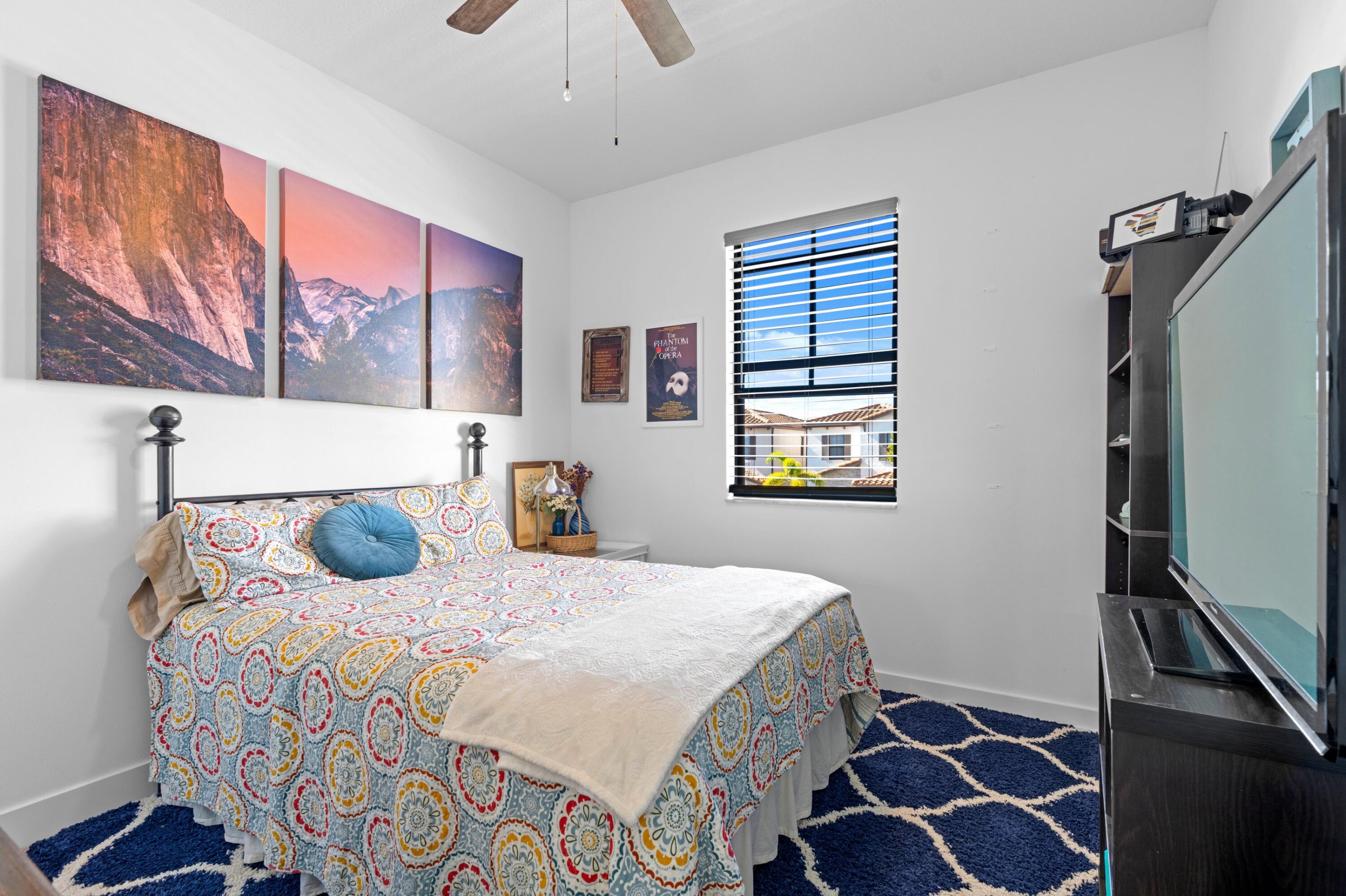 3006 Hoptree Way Riviera Beach, FL 33410 - Photo 17 of 35 a bedroom with a bed and a window