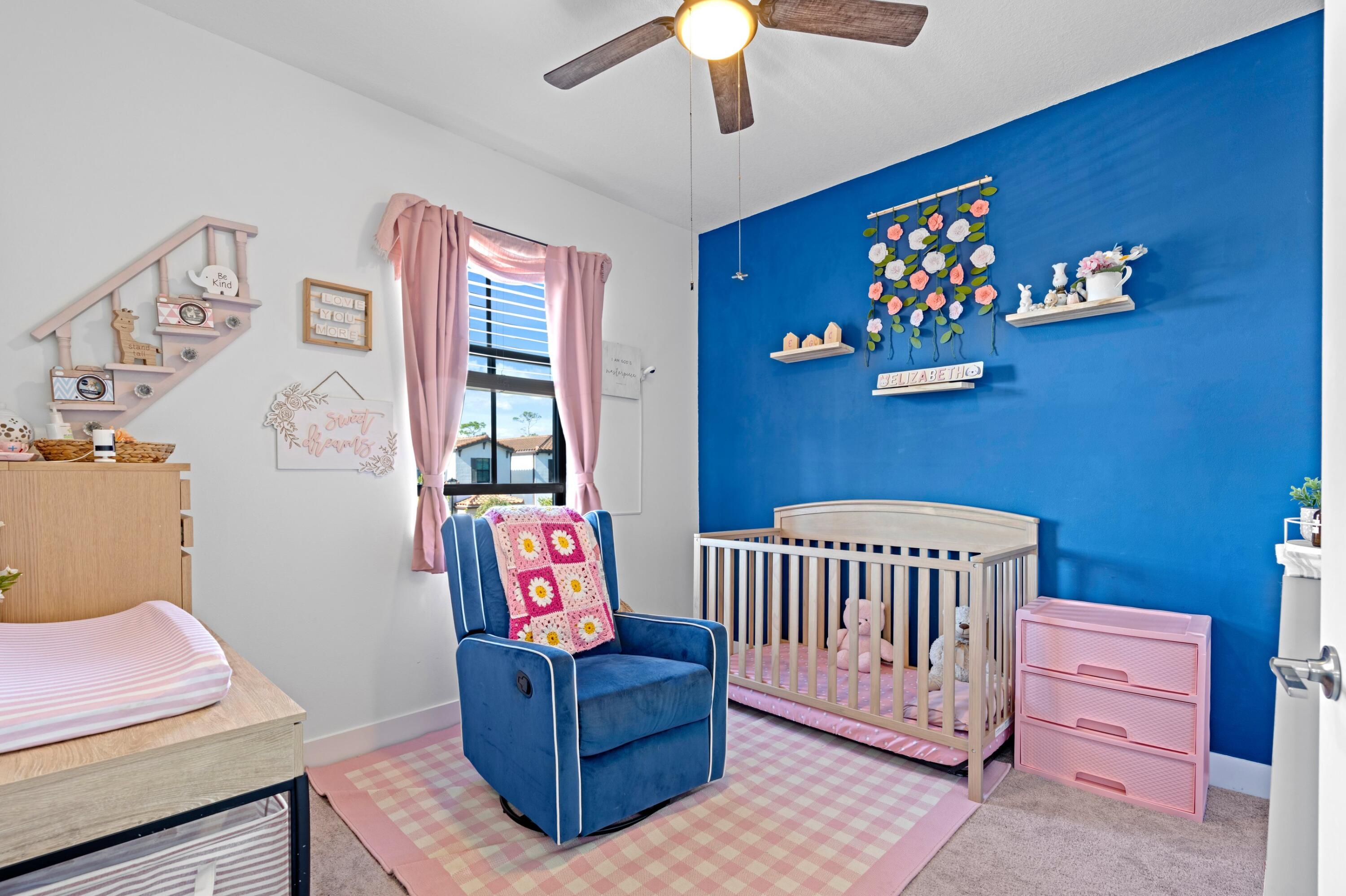 3006 Hoptree Way Riviera Beach, FL 33410 - Photo 18 of 35 a bedroom with furniture and a window