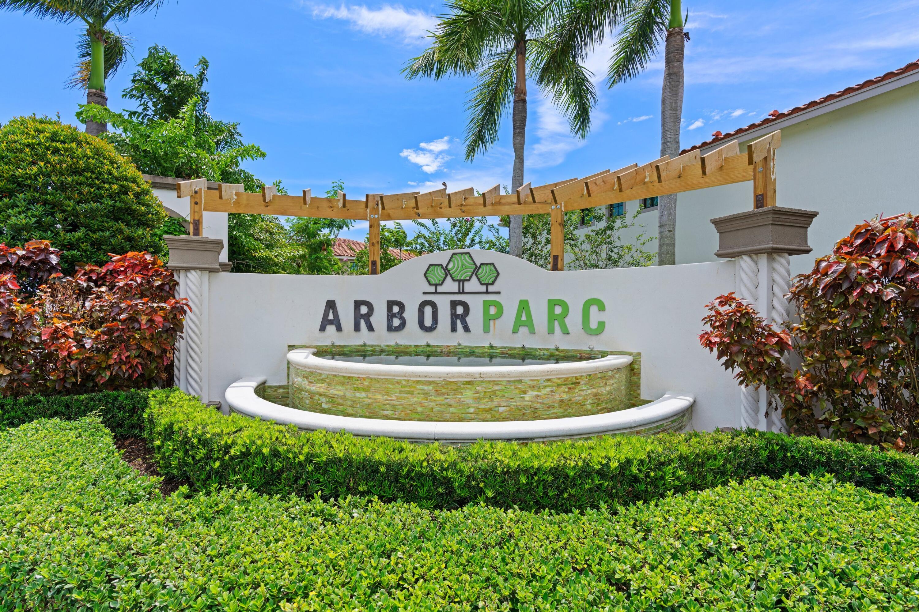 3006 Hoptree Way Riviera Beach, FL 33410 - Photo 25 of 35 a view of a house with a yard and potted plants