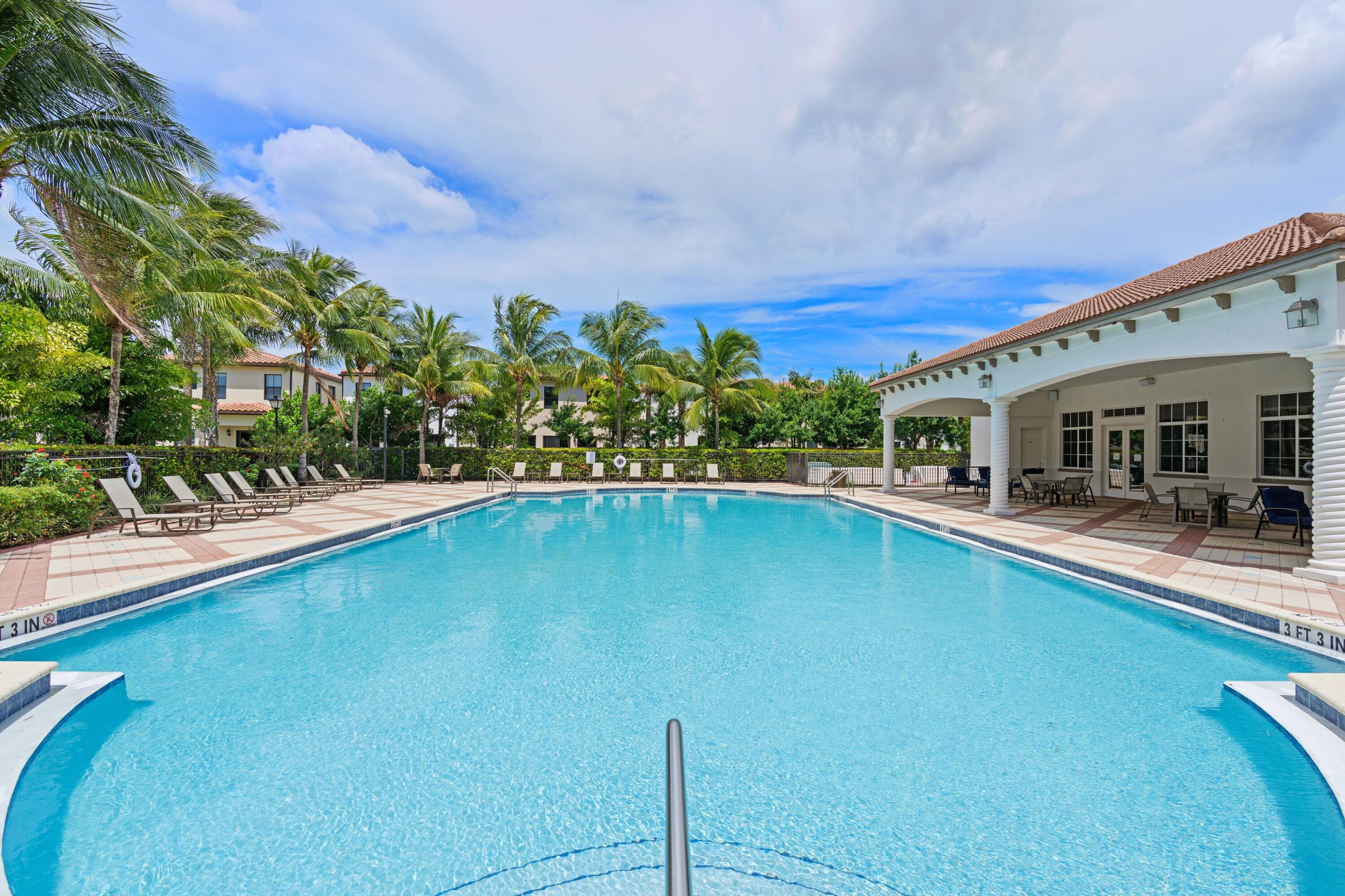 3006 Hoptree Way Riviera Beach, FL 33410 - Photo 27 of 35 a view of a house with swimming pool
