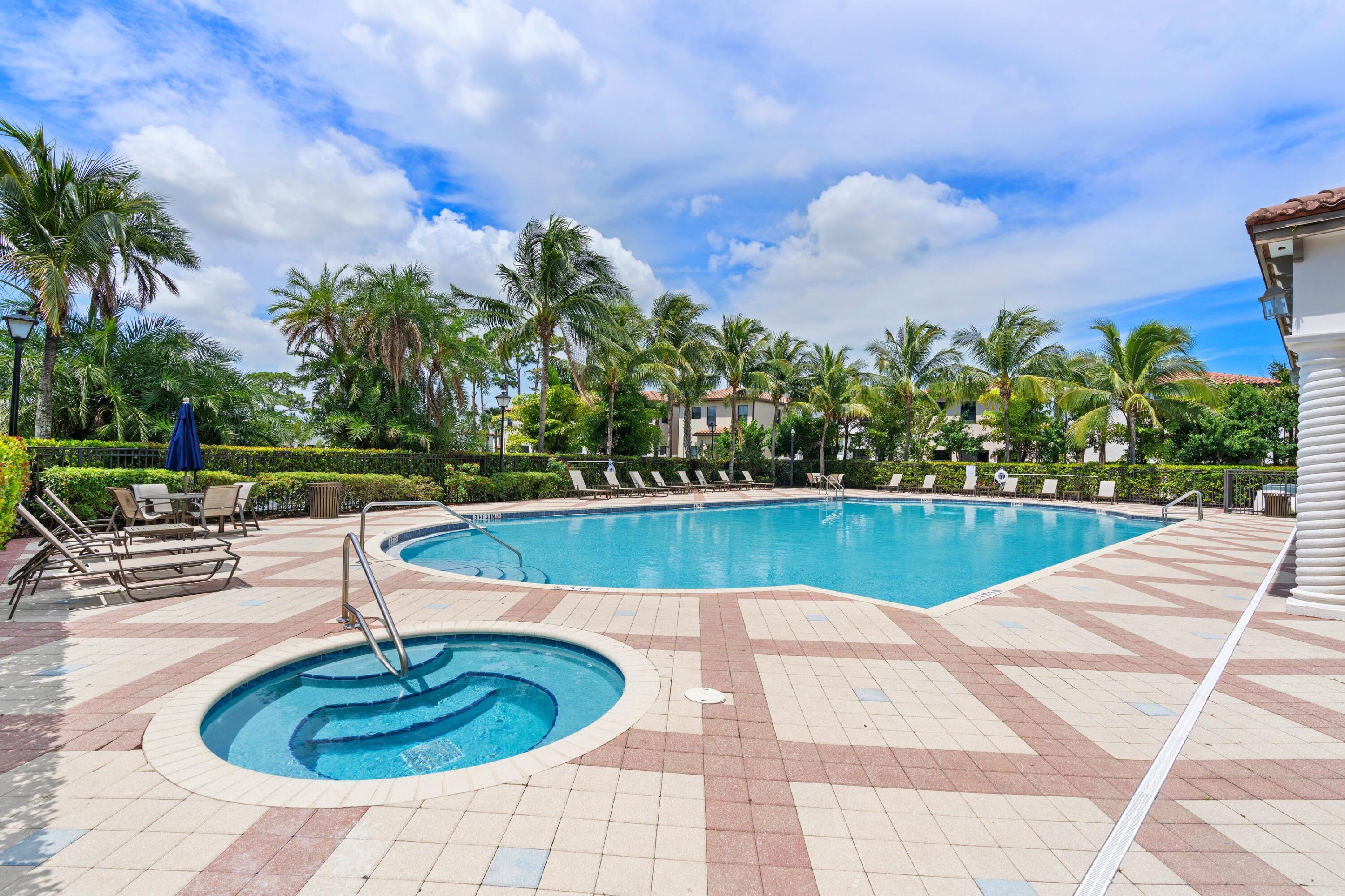 3006 Hoptree Way Riviera Beach, FL 33410 - Photo 29 of 35 a swimming pool with outdoor seating and plants