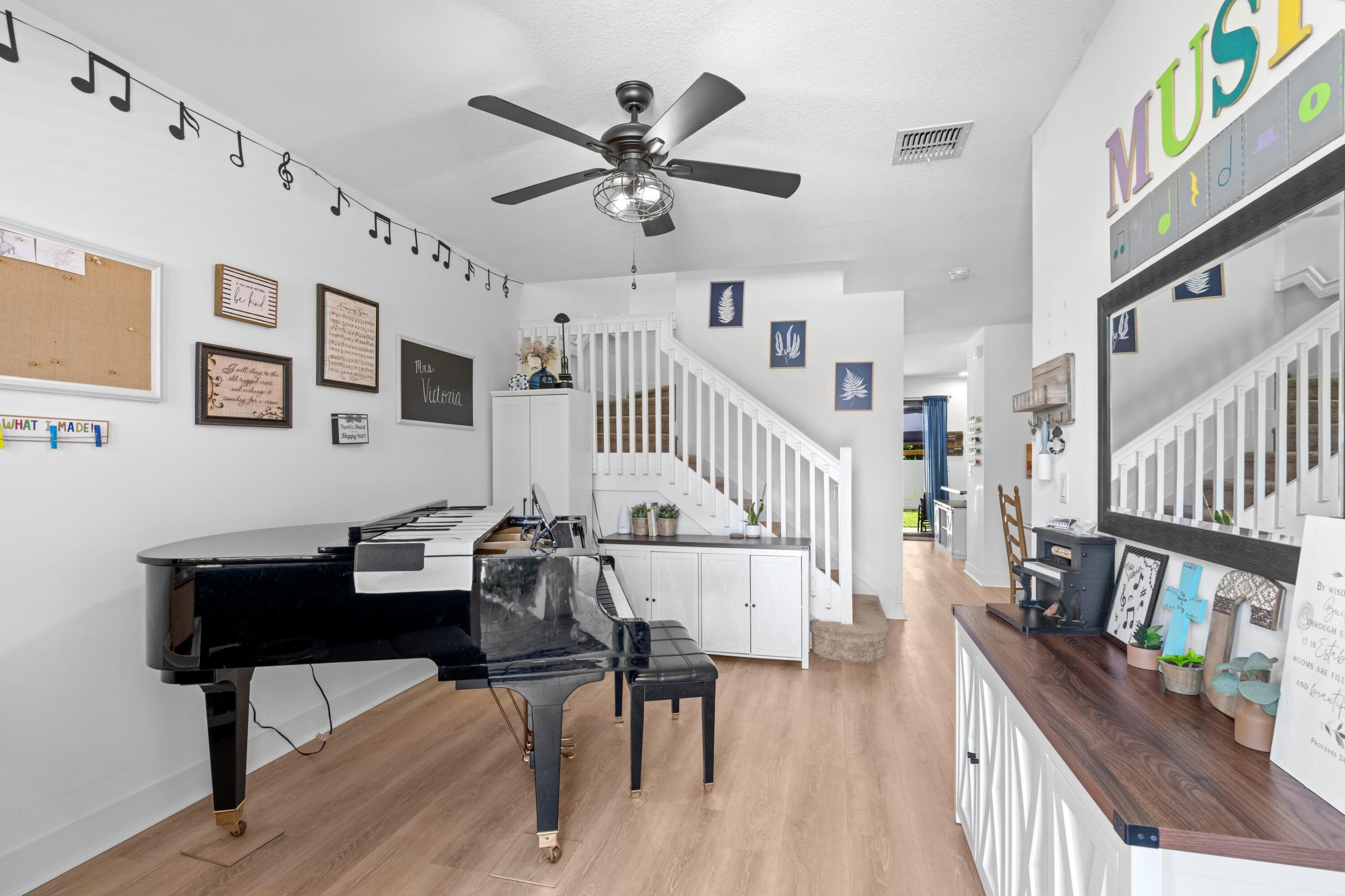 3006 Hoptree Way Riviera Beach, FL 33410 - Photo 4 of 35 a living room with furniture and a wooden floor