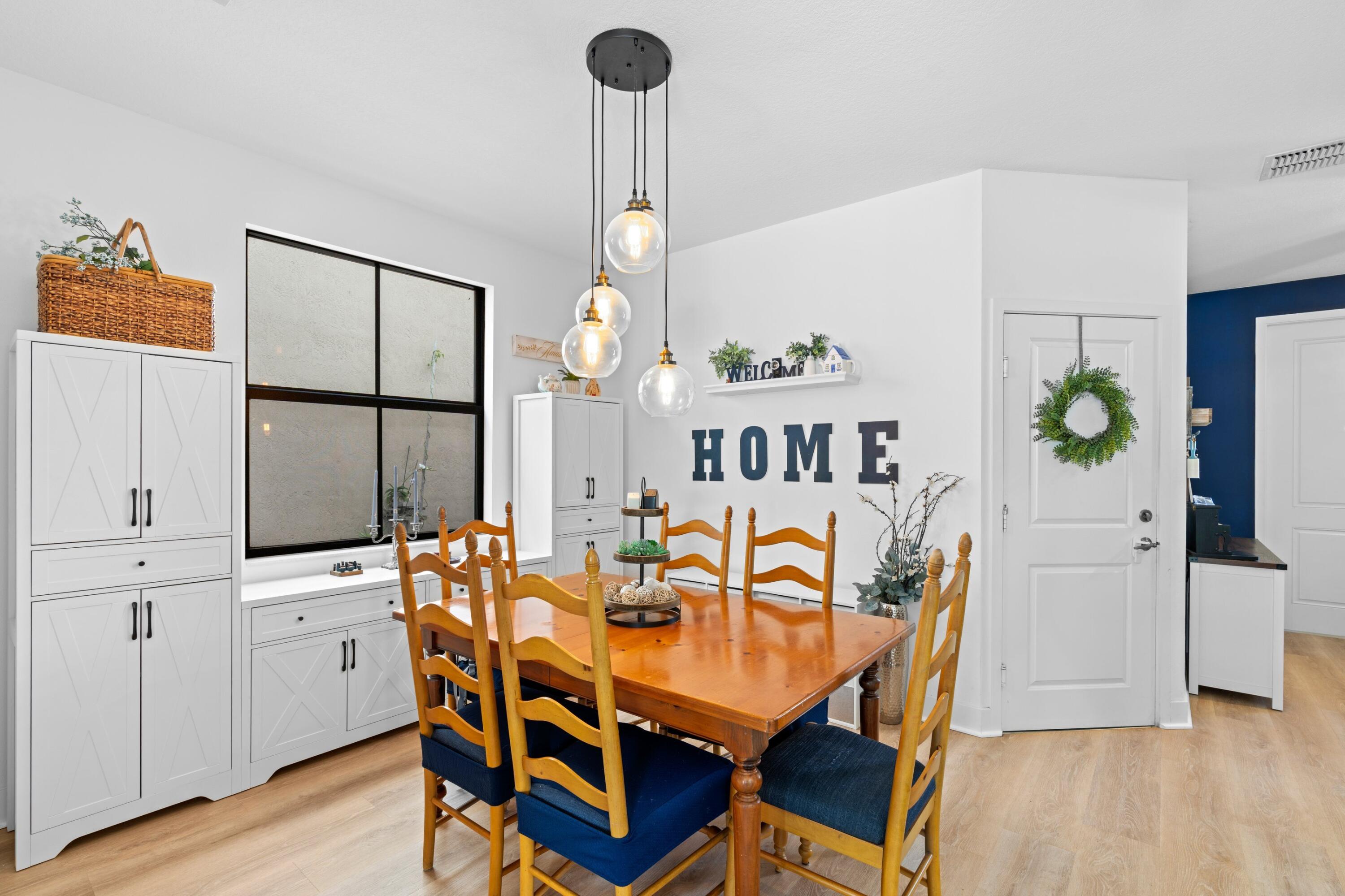 3006 Hoptree Way Riviera Beach, FL 33410 - Photo 5 of 35 a dining room with furniture and window