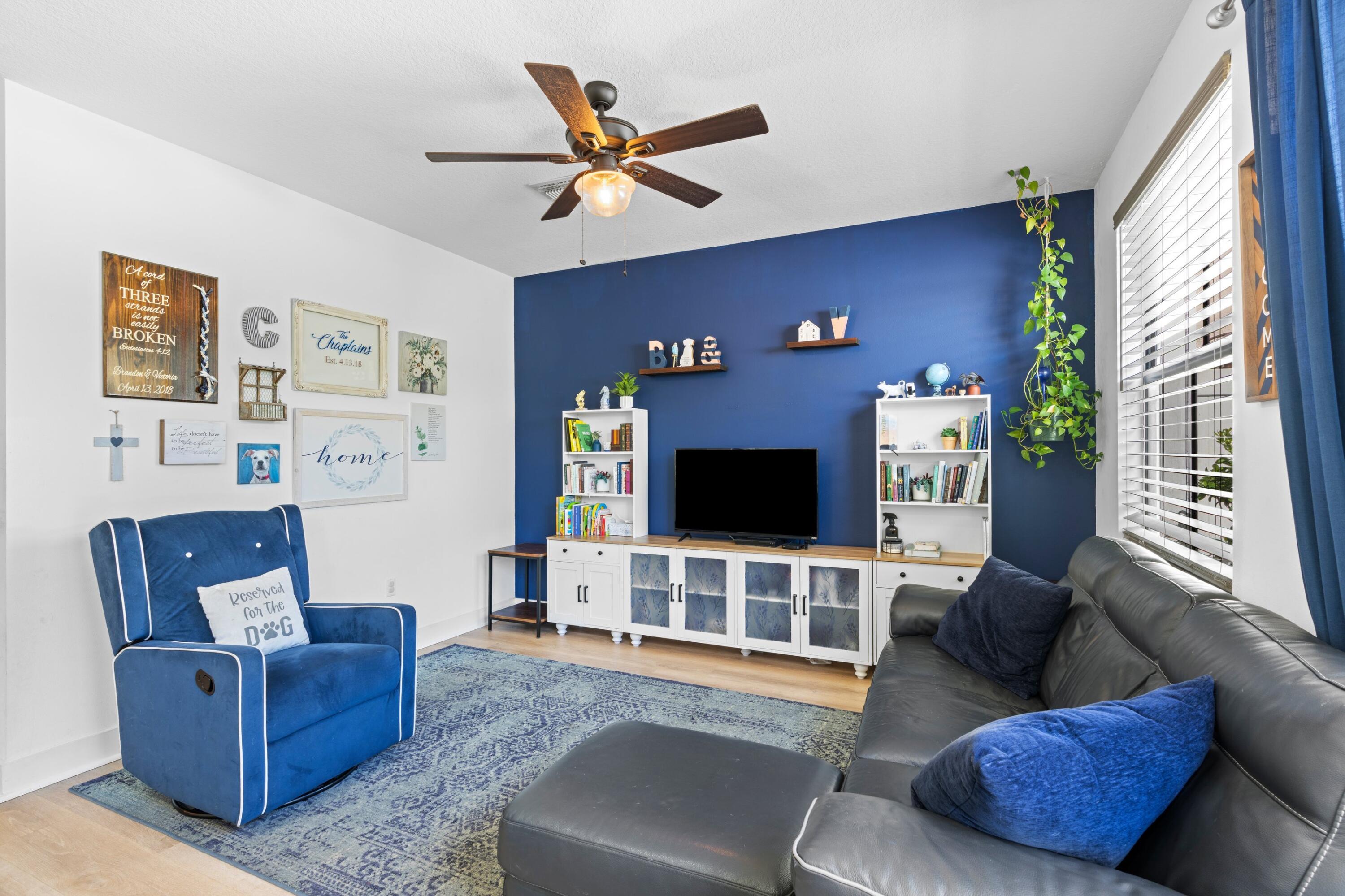 3006 Hoptree Way Riviera Beach, FL 33410 - Photo 10 of 35 a living room with furniture and a flat screen tv