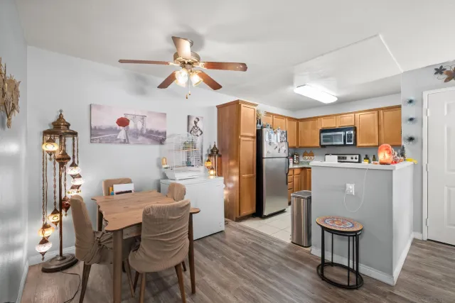 a view of a dining room with furniture wooden floor and a chandelier