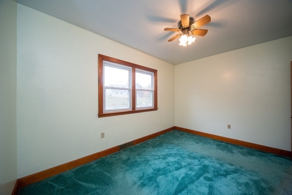 263 State Road Templeton, MA 01436 - Photo 14 of 31 an empty room with windows and a chandelier fan