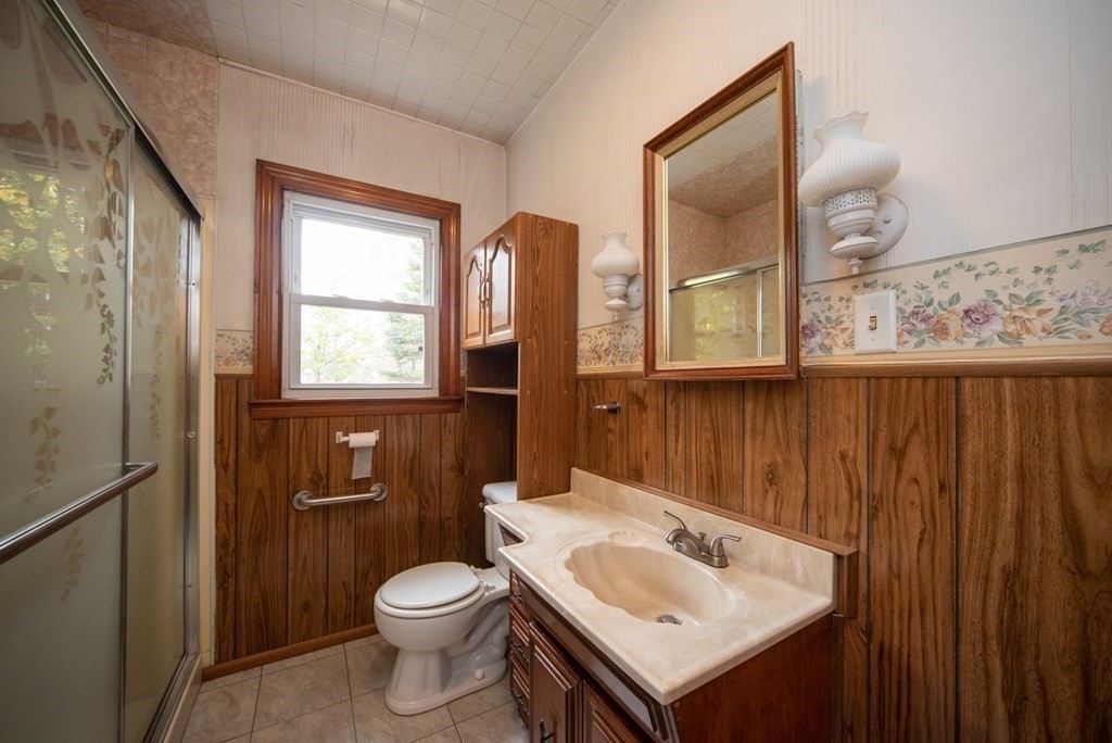 263 State Road Templeton, MA 01436 - Photo 20 of 31 a bathroom with a toilet sink and mirror